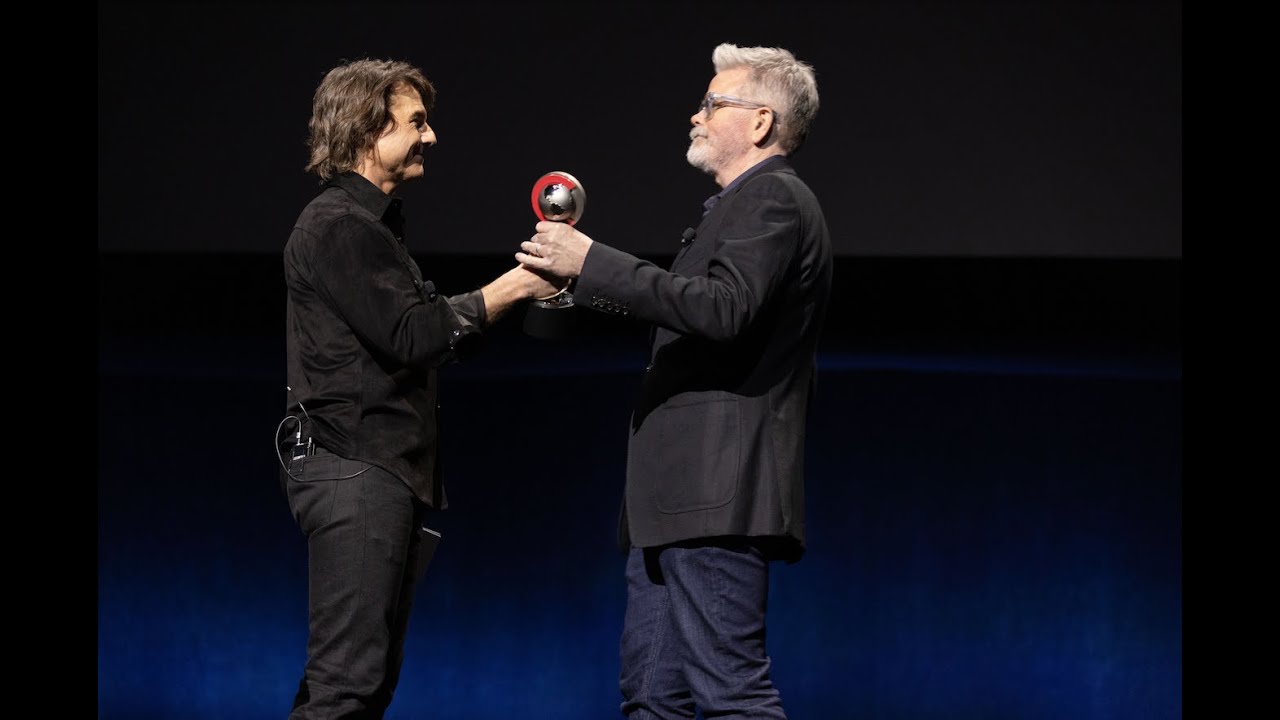 Tom Cruise presents Christopher McQuarrie with Cinema Con’s Director of the Year award
