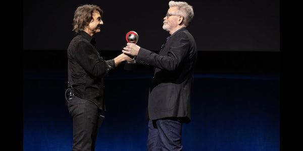 Tom Cruise presents Christopher McQuarrie with Cinema Con’s Director of the Year award